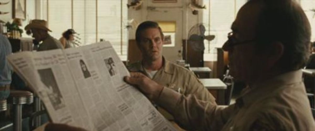 In "No Country for Old Men" (2007) the page in Tommy Lee Jones' hands is the same as the one on the table, suggesting that the prop master bought 2 copies to make the paper look fuller, but made the mistake of leaving the stock spread facing up.