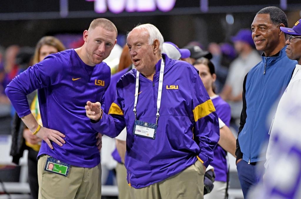 John Robinson and Ed Orgeron at LSU Leave USC Nation in a Purple Haze