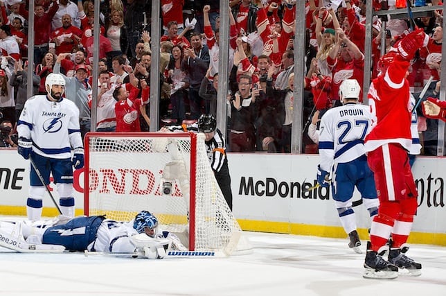 Lightning goalie Ben Bishop tries to bat the puck away, but it winds up in his own net