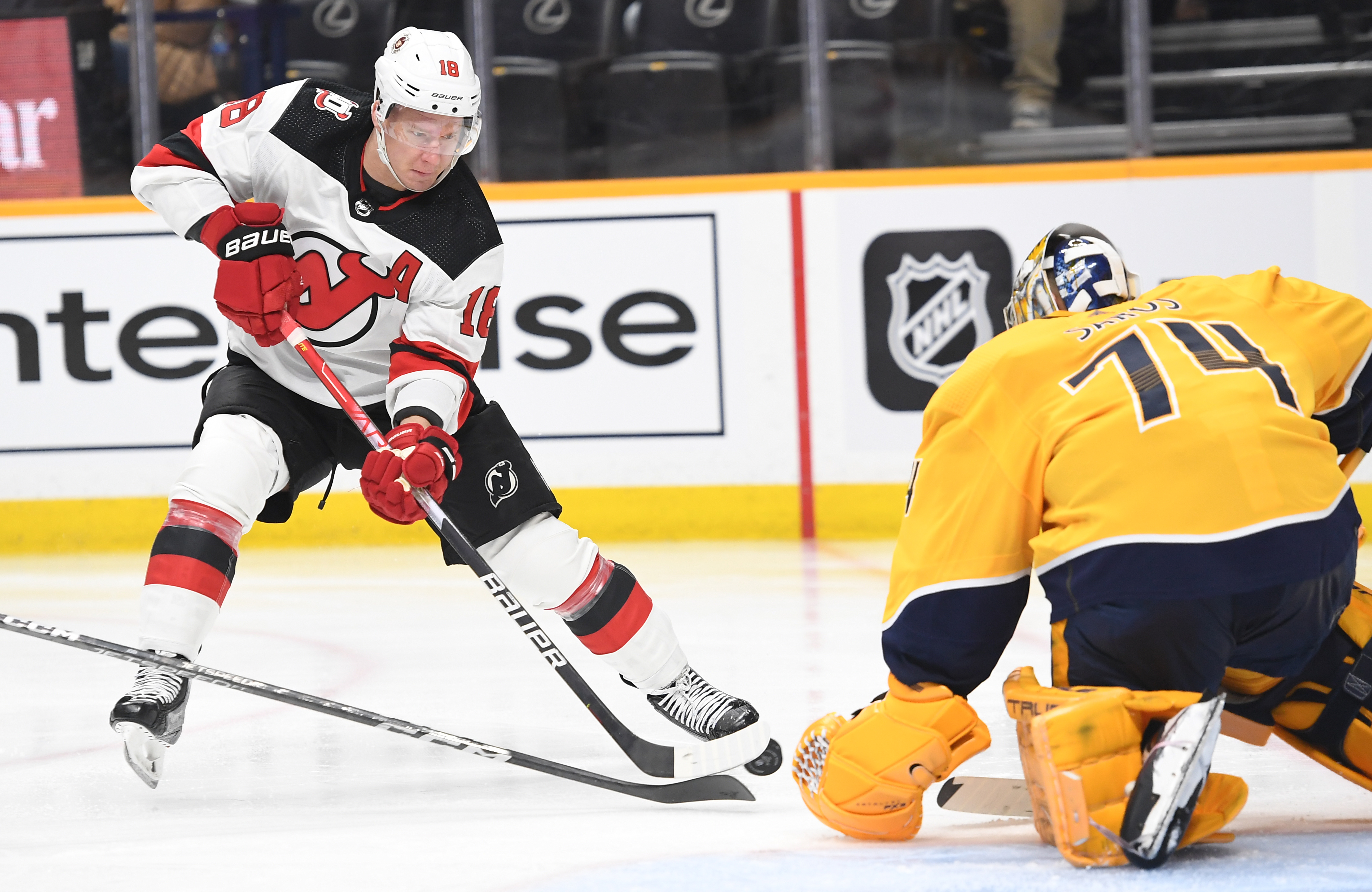 Jan 26, 2023; Nashville, Tennessee, USA; New Jersey Devils left wing Ondrej Palat (18) has a shot blocked by Nashville Predators goaltender Juuse Saros (74) during the second period at Bridgestone Arena. Mandatory Credit: Christopher Hanewinckel-USA TODAY Sports - Gameday Preview: Devils @ Predators