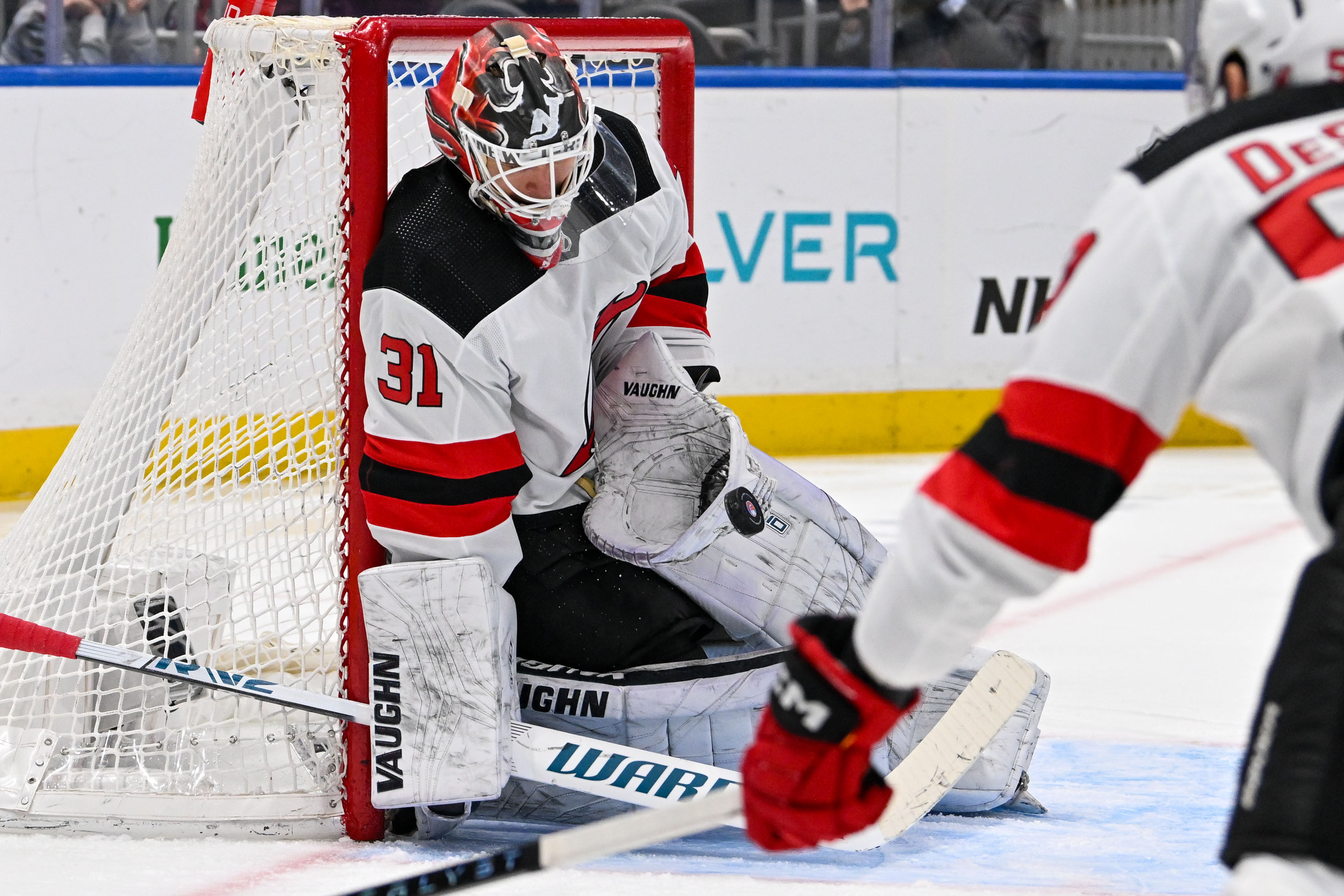Mar 24, 2024; Elmont, New York, USA; New Jersey Devils goaltender Kaapo Kahkonen (31) makes a save against the New York Islanders during the second period at UBS Arena. Mandatory Credit: Dennis Schneidler-USA TODAY Sports - Former Devils Goaltender Placed On NHL Waivers