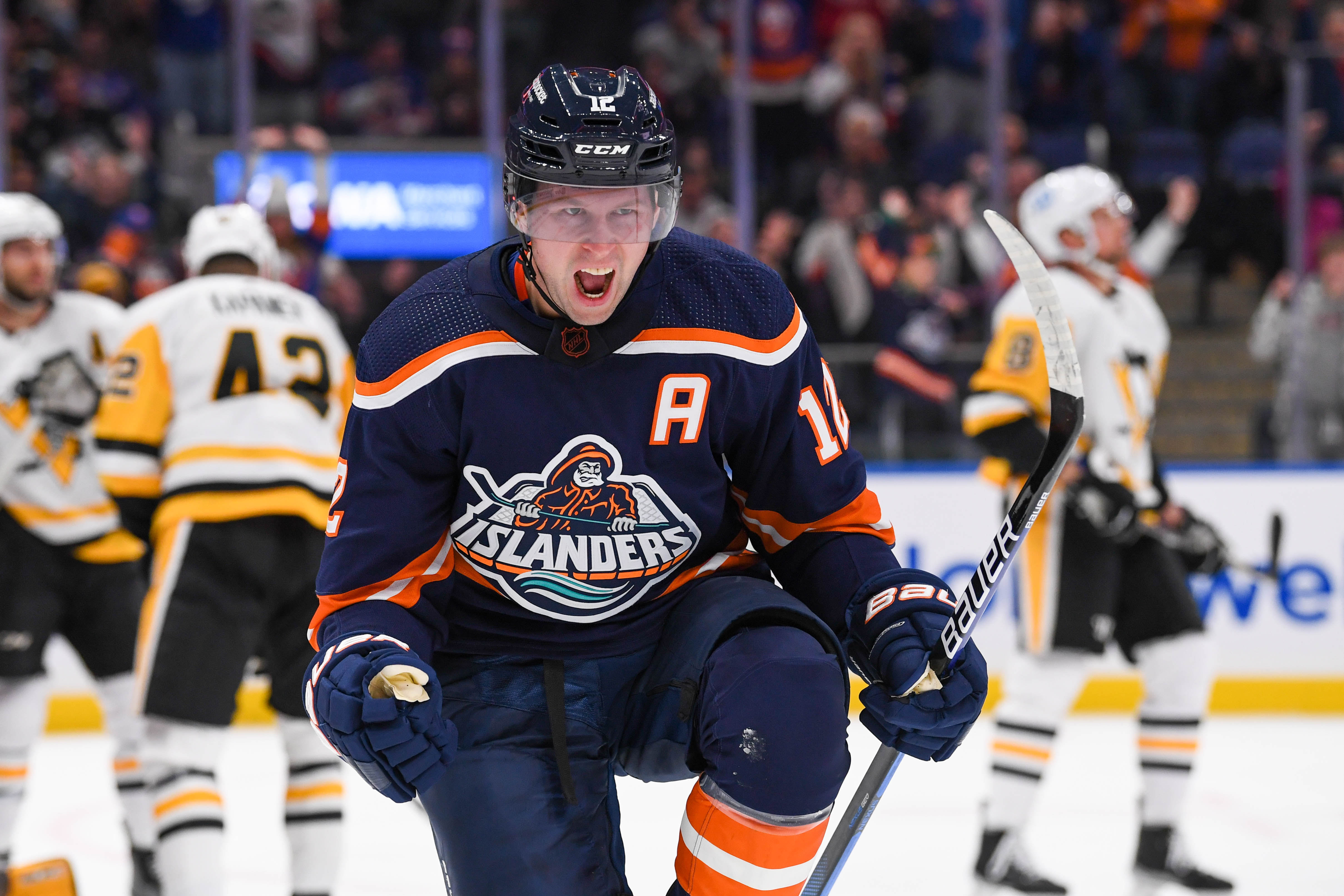 Dec 27, 2022; Elmont, New York, USA; New York Islanders right wing Josh Bailey (12) celebrates his goal against the Pittsburgh Penguins during the second period at UBS Arena. Mandatory Credit: Dennis Schneidler-USA TODAY Sports - Senators Pour a Little Bailey Into Their Training Camp Mix