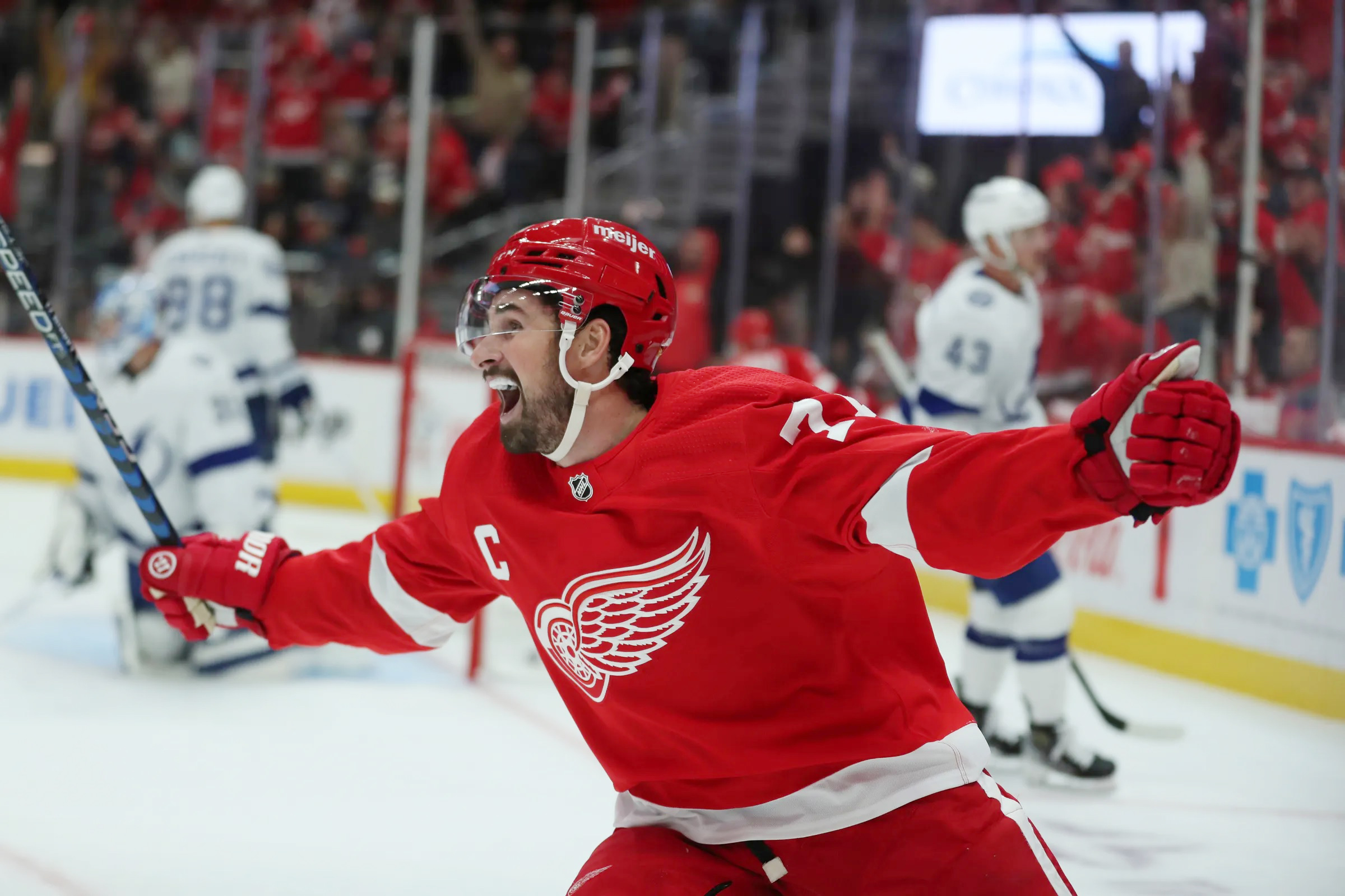 Oct 14, 2023; Detroit, Michigan, USA; Detroit Red Wings center Dylan Larkin celebrates a goal by right wing Alex DeBrincat against Tampa Bay Lightning goaltender Jonas Johansson during first-period action on Saturday, Oct. 14, 2023, in Detroit, Michigan. Mandatory Credit: Kirthmon F. Dozier-USA TODAY Sports - Red Wings 6, Lightning 4: "Things Just Went Right Today"