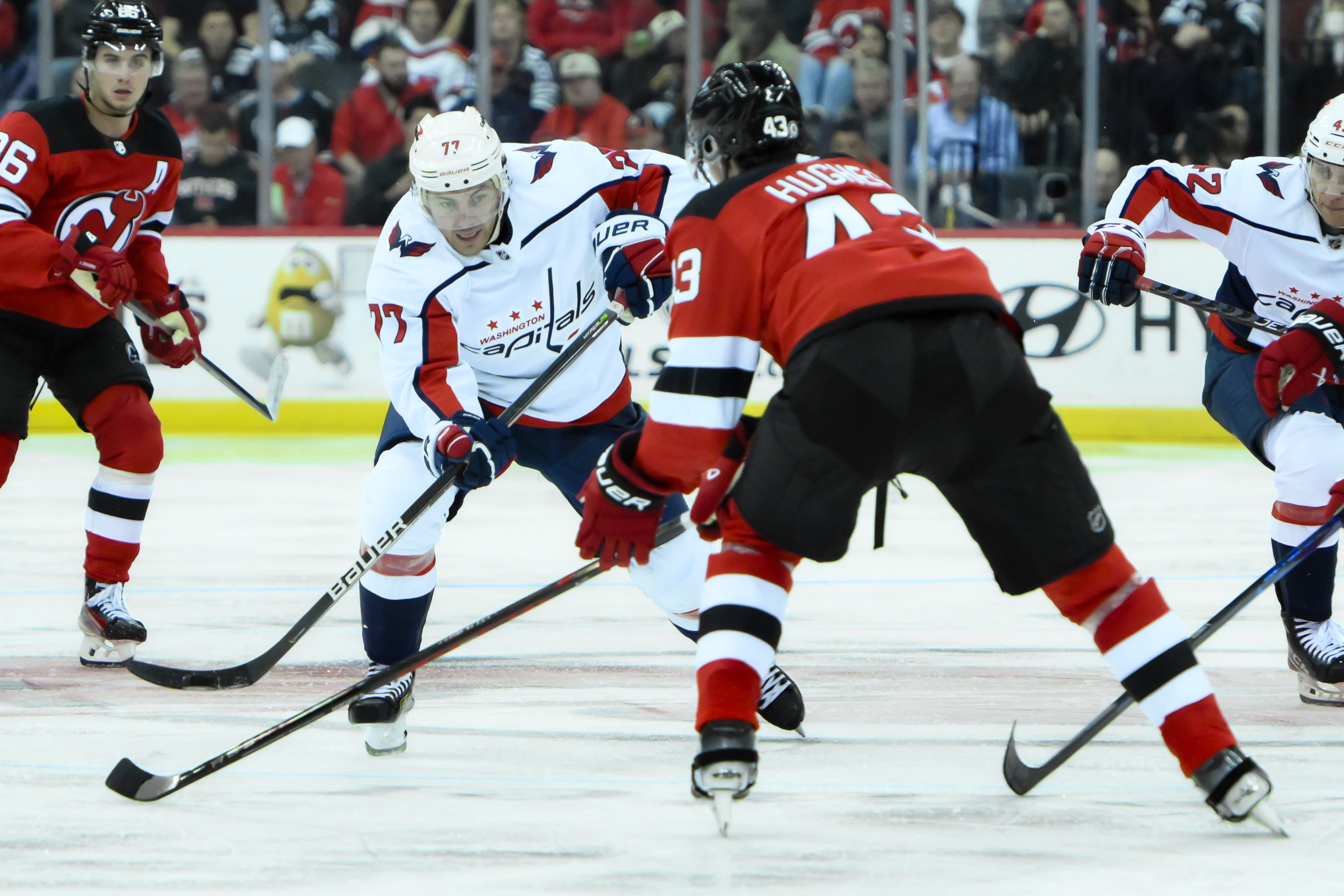Oct 25, 2023; Newark, New Jersey, USA; Washington Capitals right wing T.J. Oshie (77) skates with the puck against New Jersey Devils defenseman Luke Hughes (43) during the third period at Prudential Center. Mandatory Credit: John Jones-USA TODAY Sports - Gameday Preview: Devils vs. Capitals. Is Alex Holtz a Possible Scratch?