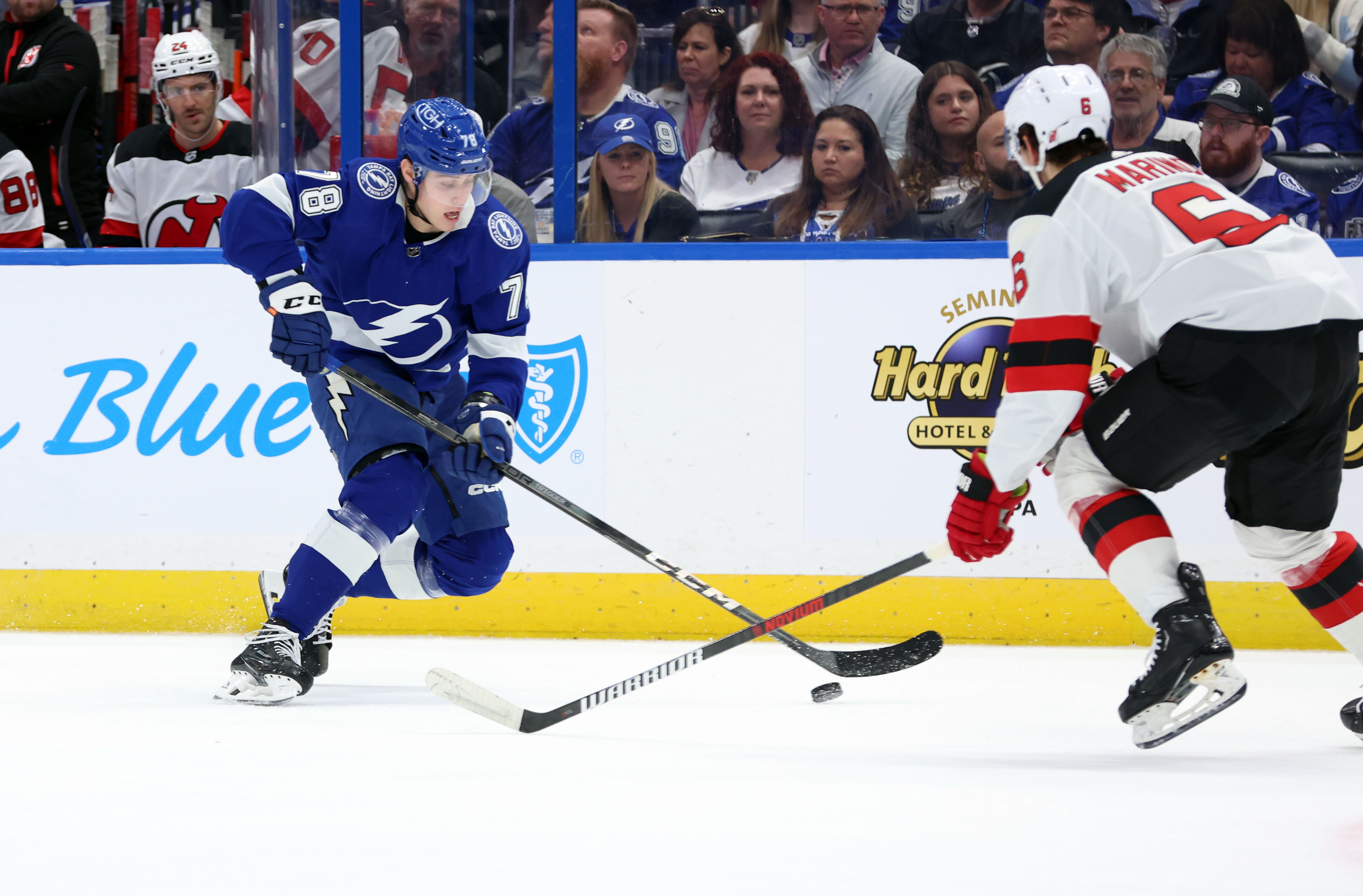 Jan 27, 2024; Tampa, Florida, USA; Tampa Bay Lightning defenseman Emil Martinsen Lilleberg (78) skates with the puck as New Jersey Devils defenseman John Marino (6) defends during the first period at Amalie Arena. Mandatory Credit: Kim Klement Neitzel-USA TODAY Sports - Lightning Hand Devils Embarrassing 6-3 Loss Ahead of All-Star Break