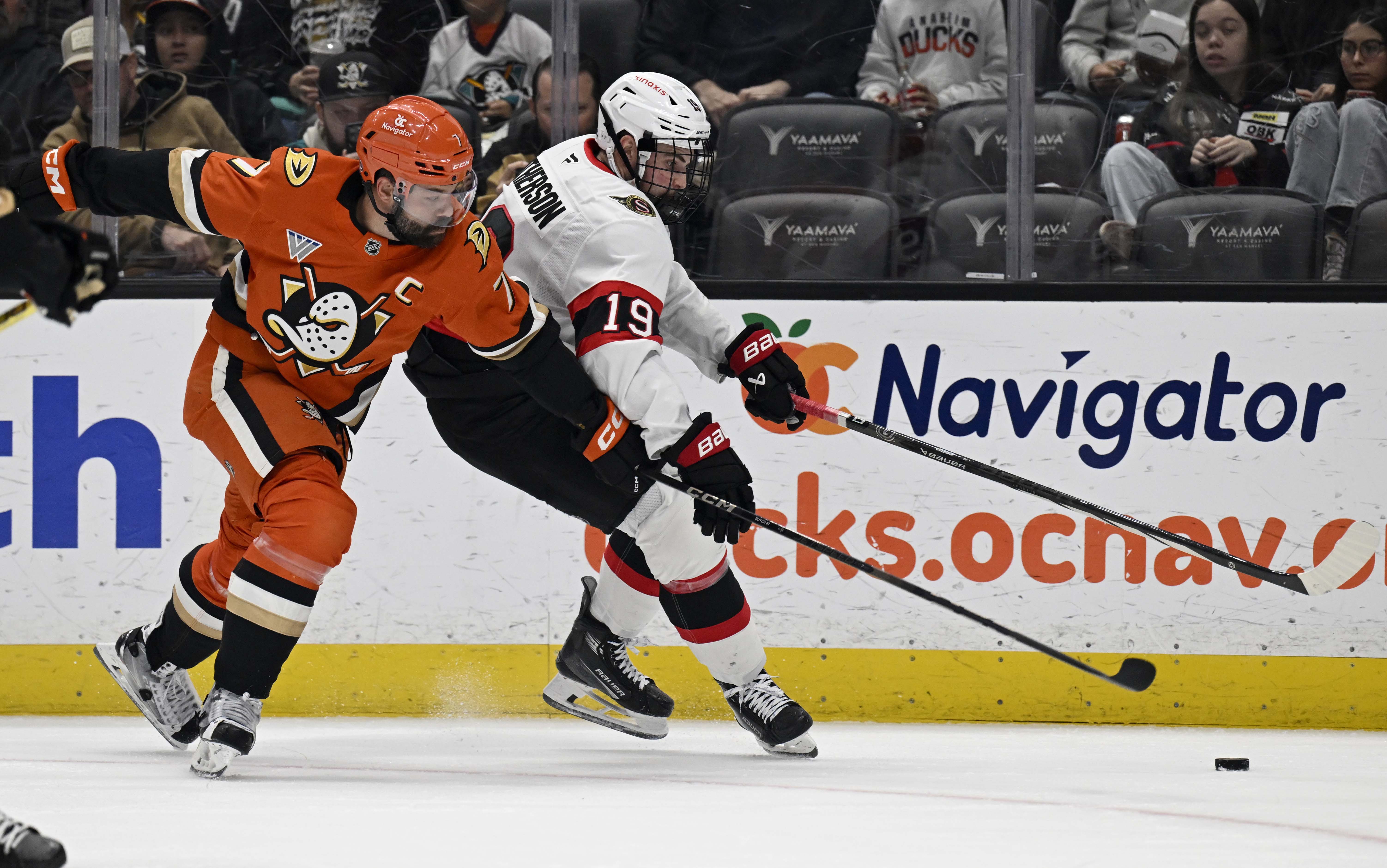 Dec 1, 2024; Anaheim, California, USA; Anaheim Ducks defenseman Radko Gudas (7) vies for the puck with Ottawa Senators right wing Drake Batherson (19) during the first period at Honda Center. Mandatory Credit: Alex Gallardo-Imagn Images - Ottawa Senators Fall To Anaheim Ducks 4-3 In A Shootout