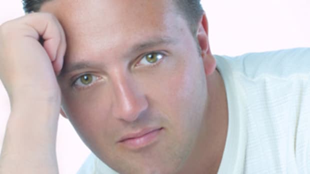 Psychic medium John Edward communicates with the dead and reconnects them with their loved ones