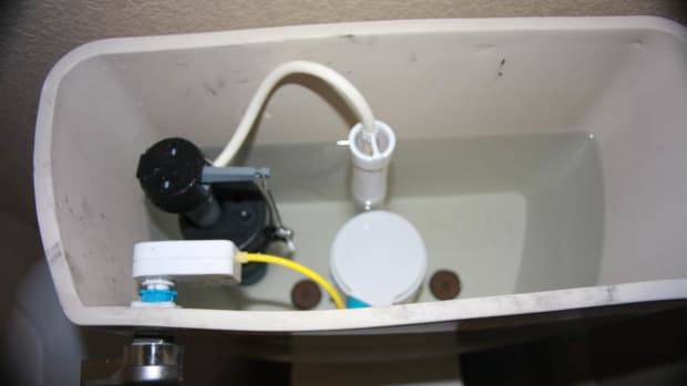 In this photo you see that I chose to keep my toilet's original valve assembly and simply install only the dual flush valve and handle.