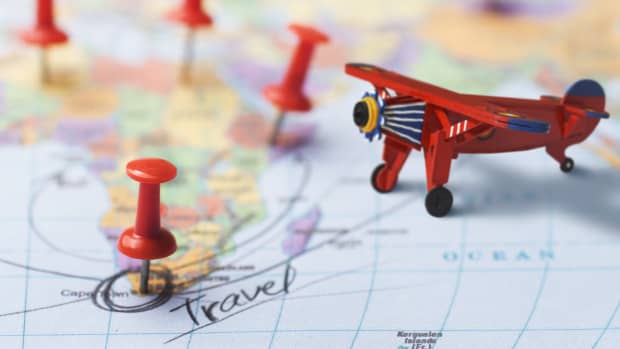 Close up of travel map on Africa with pins and a toy airplane