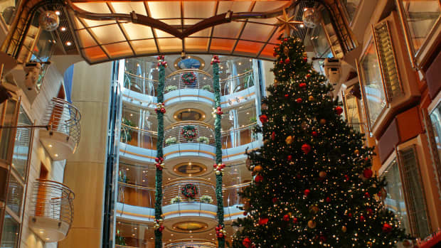 Giant Christmas tree and holiday decorations on the promenade of a cruise ship