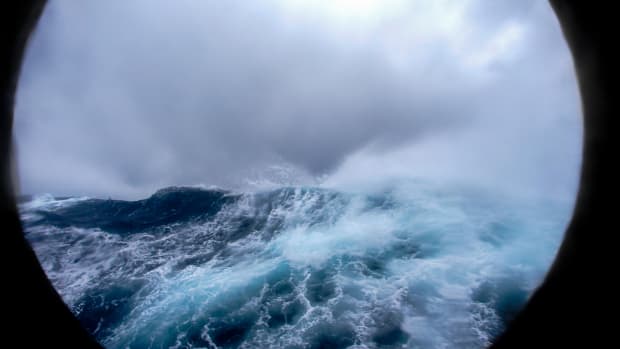 View of the rough waters of the Drake Passage through a porthole