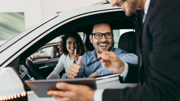 couple buying a new car