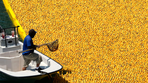 Thousands of yellow rubber ducks crowd the Chicago River as they float in the 2021 Chicago Duck Derby