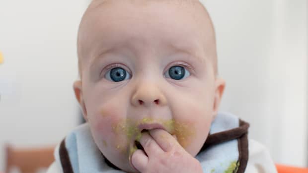 baby eating avocado