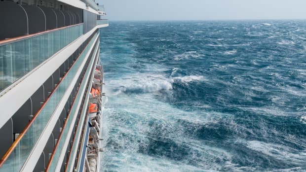 Rough choppy waters alongside a cruise ship