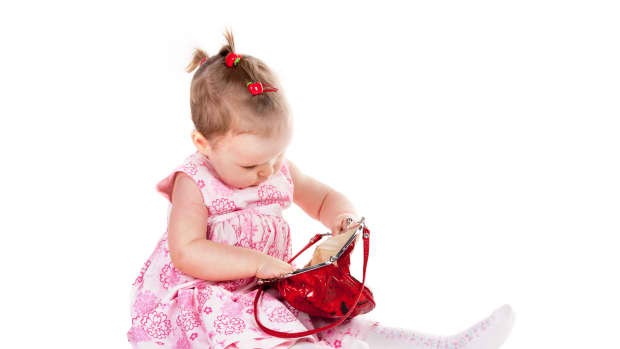 baby with purse