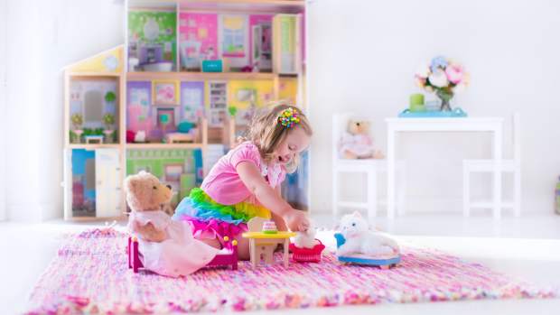 toddler girl playing in bedroom