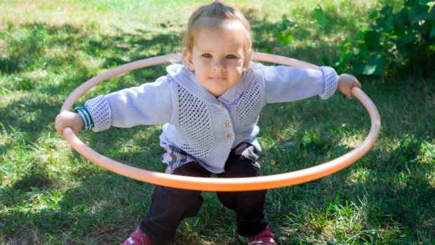 toddler with hula hoop