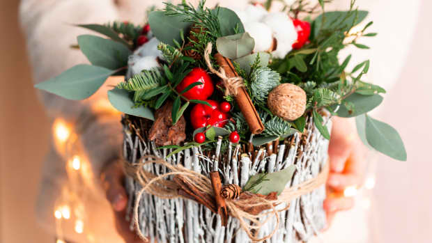 a bundle of twigs with greenery, herbs and spices tied with twine, Christmas or Yule decoration