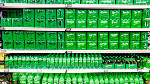 Bottles of sparkling sweet drink Sprite in supermarket.