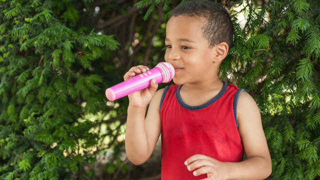 toddler boy with microphone