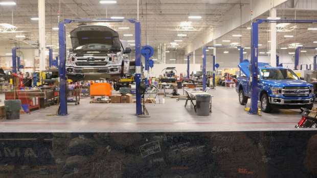mechanic shop with truck on lift