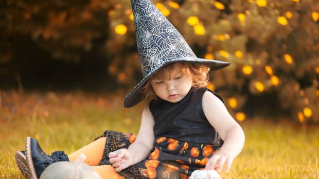 little girl dressed as a witch