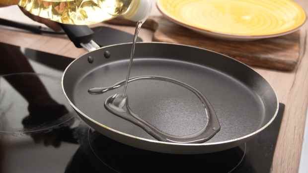 A non-stick pan with cooking oil.