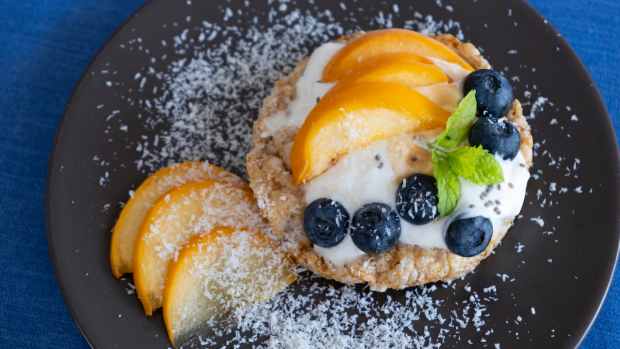 Rice cakes topped with fruit and cream cheese.