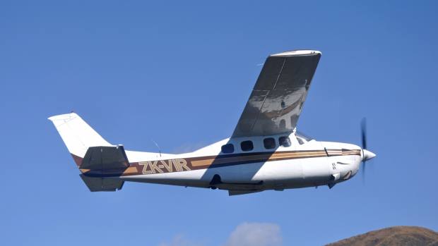 A Cessna 210 aircraft in flight