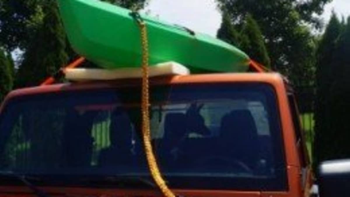 How to Strap a Kayak to a Soft Top Jeep for Transport - SkyAboveUs