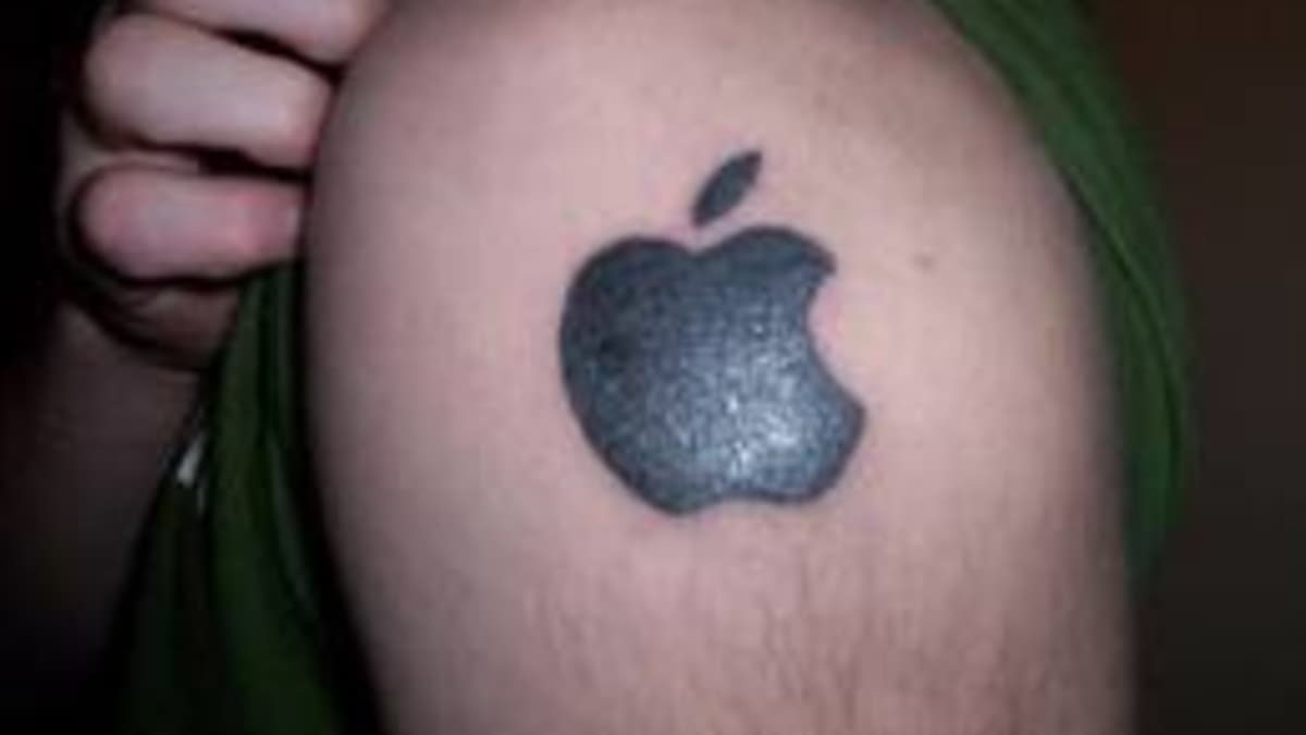 Small apple tattoo on the wrist