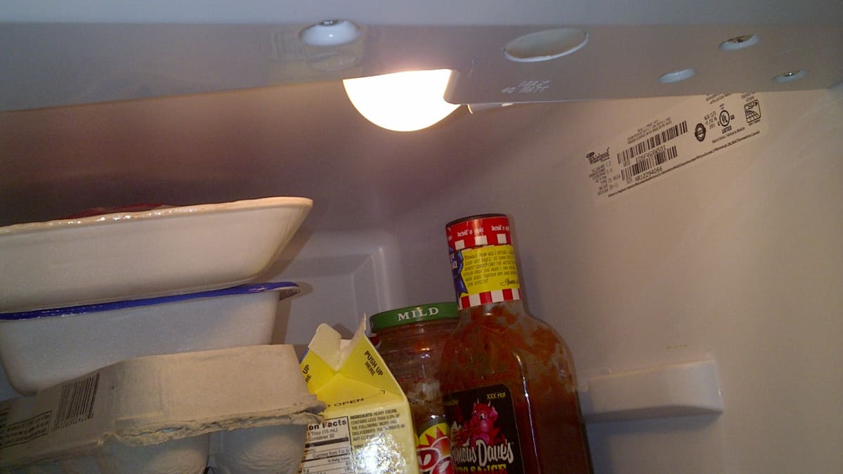 Refrigerator light burned out (first picture). Ordered a replacement  (second picture) but it doesn't screw in. What am I doing wrong? Seems like  there is one too many rungs : r/Home