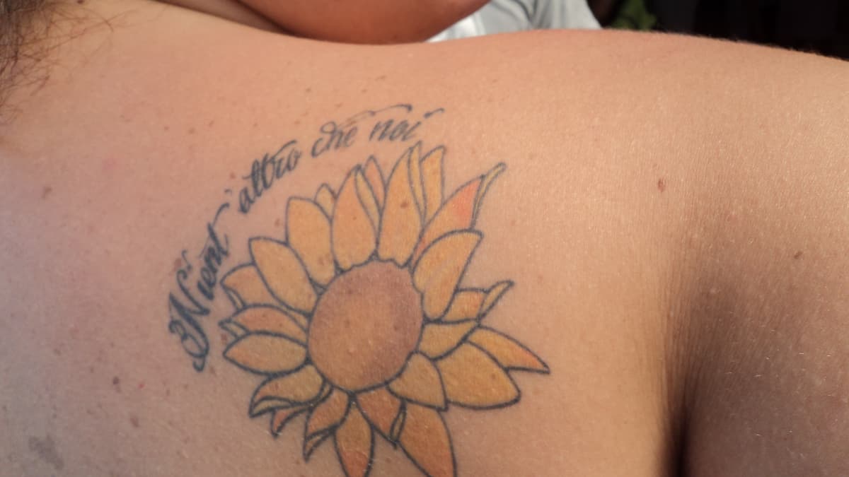 Tattoo uploaded by Stacie Mayer • A simple font off-set by some pretty  sunflowers. Tattoo by Leah Greenwood. #sunflower #flower #quote  #newotraditional #LeahGreenwood • Tattoodo