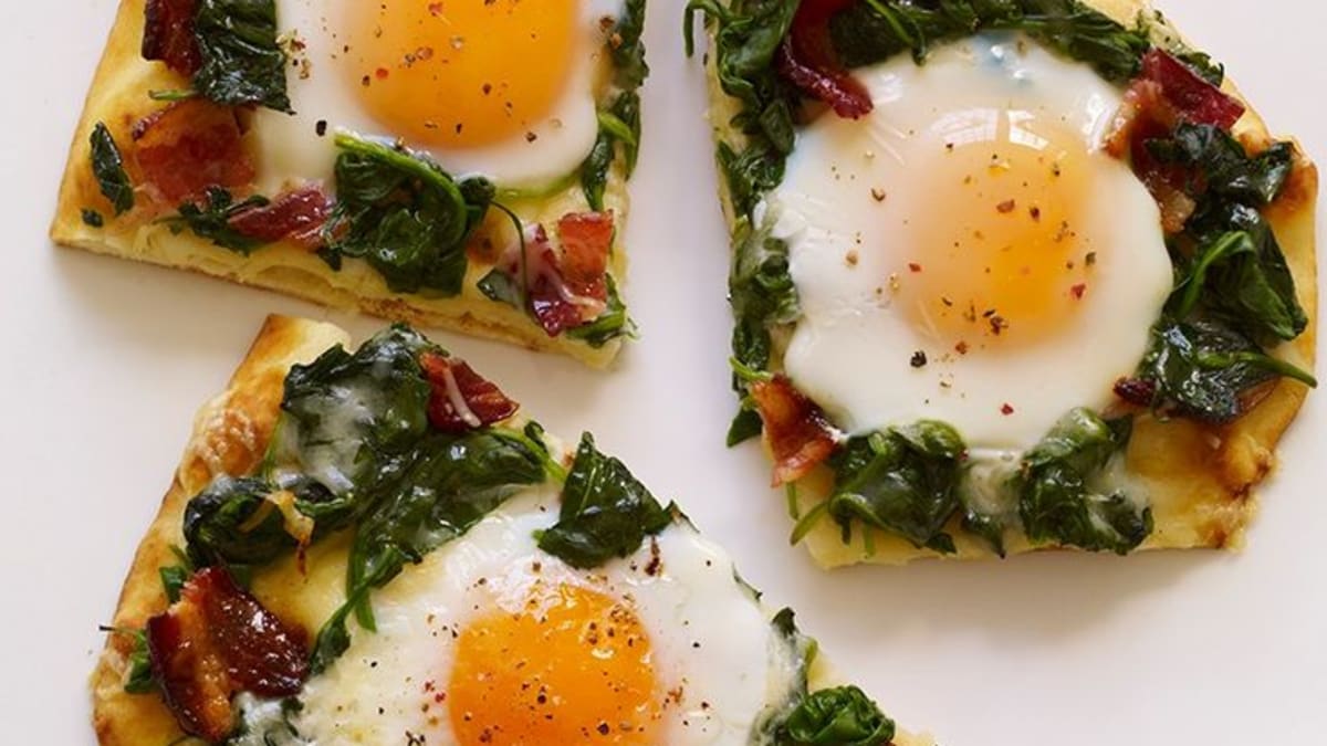 Breakfast Pizza With Sunny Side Up Eggs Kale And Bacon Delishably