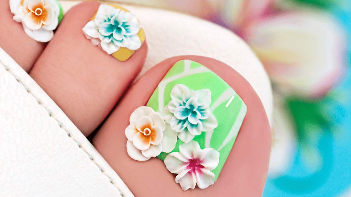 Free Photo | Beautiful woman's nails of legs with beautiful french manicure  and art design