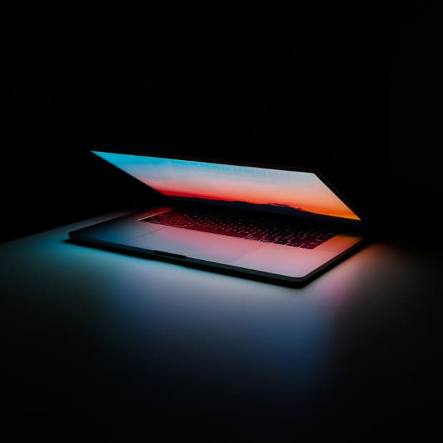 glowing computer screen with black background