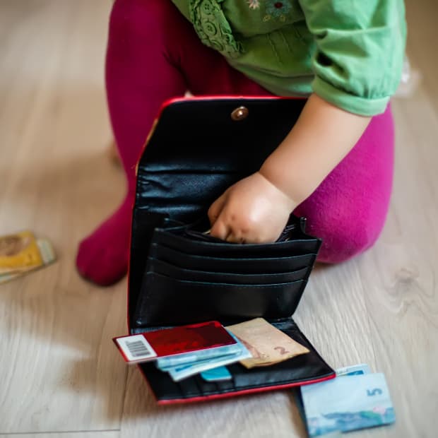 little girl with wallet