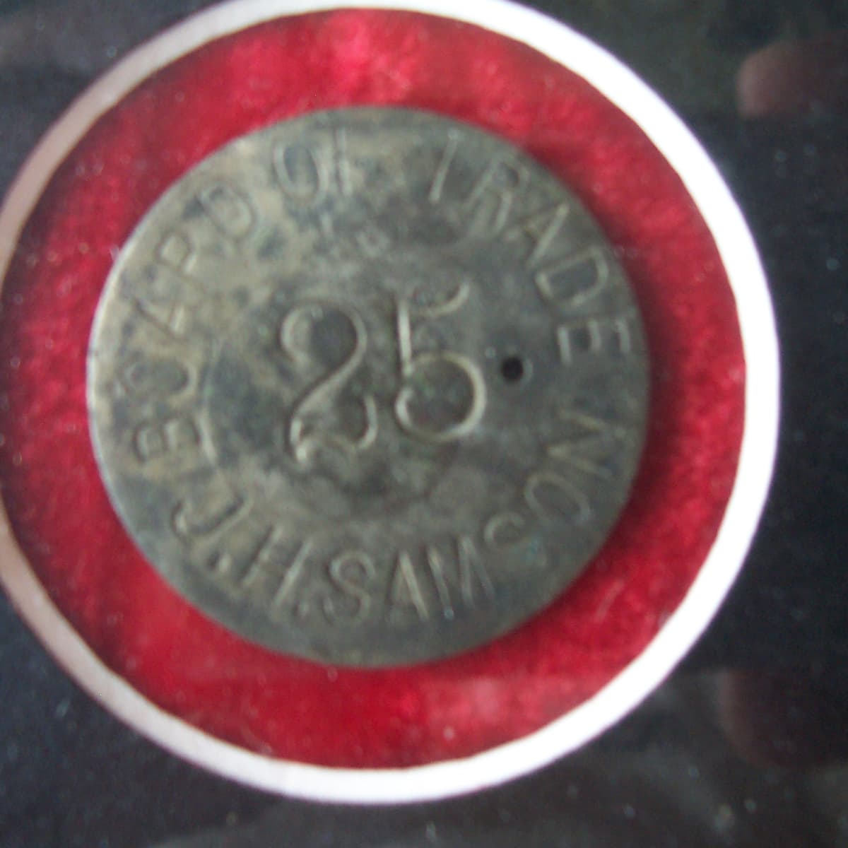 An eight sided antique brass token from Cliff's Place of Geneva,Nebraska  good for 5 cents in trade.