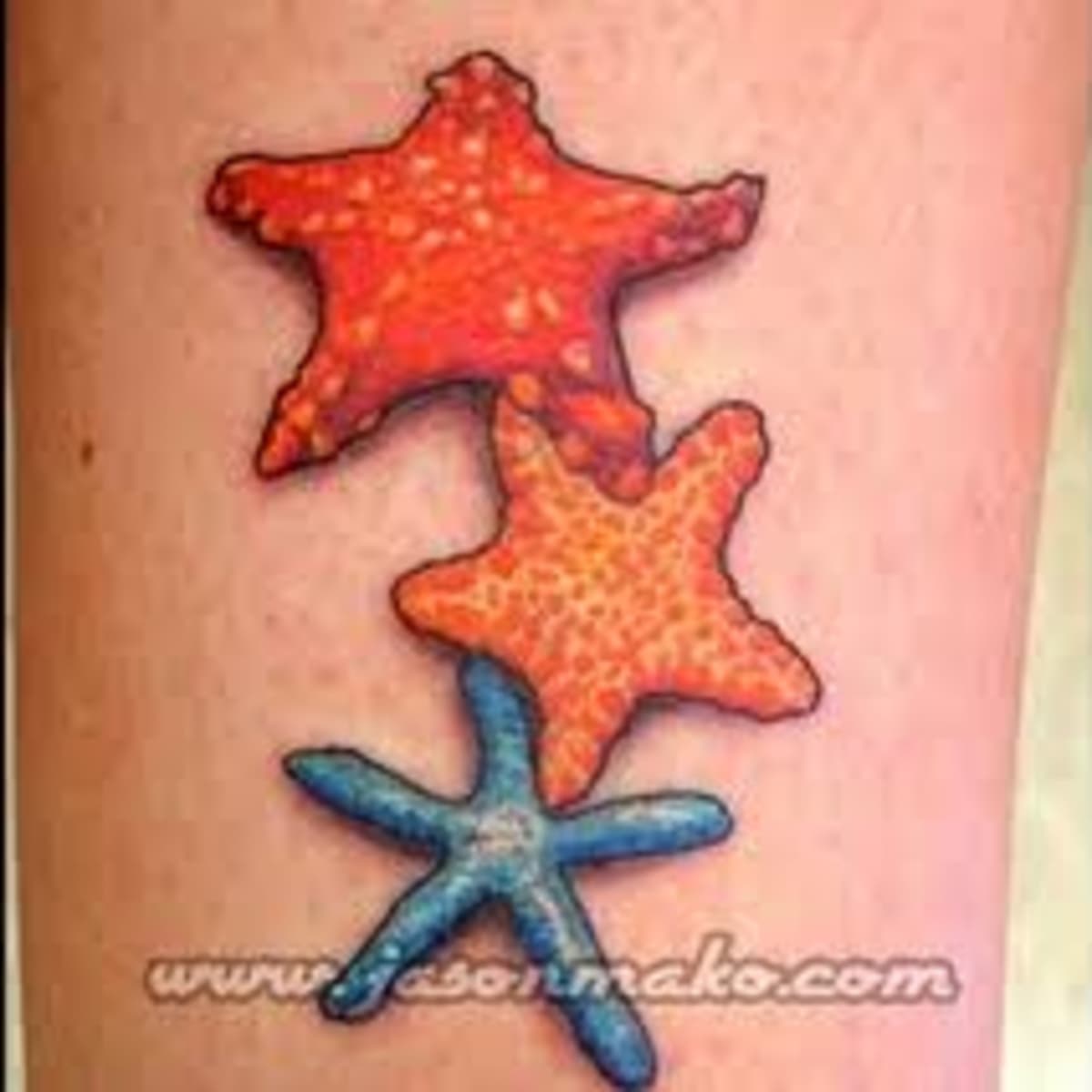 Ornamental north star tattooed on the back of the neck.