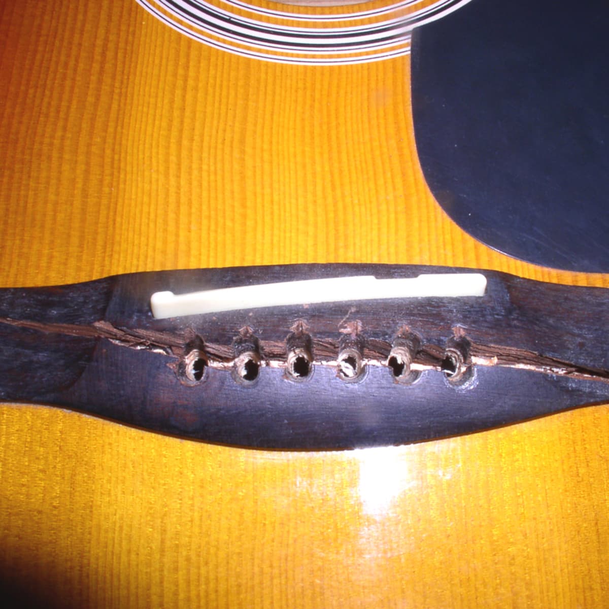 broken guitar saddle