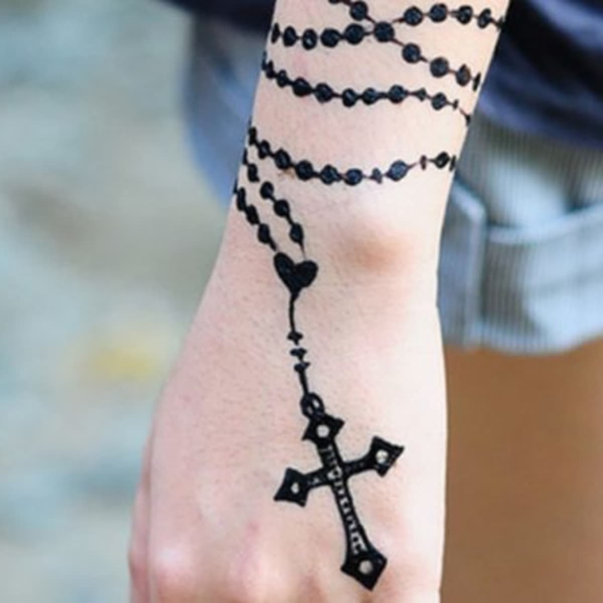 praying hands with cross and rosary tattoo