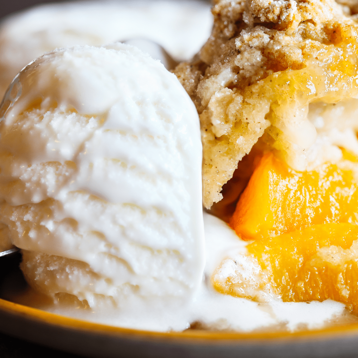 https://images.saymedia-content.com/.image/ar_1:1%2Cc_fill%2Ccs_srgb%2Cq_auto:eco%2Cw_1200/MTk4ODIzMjE3OTY2NjIyMDU5/grand-pappys-homemade-peach-ice-cream.png