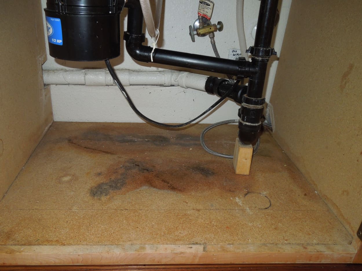 kitchen sink cabinet water damage repair