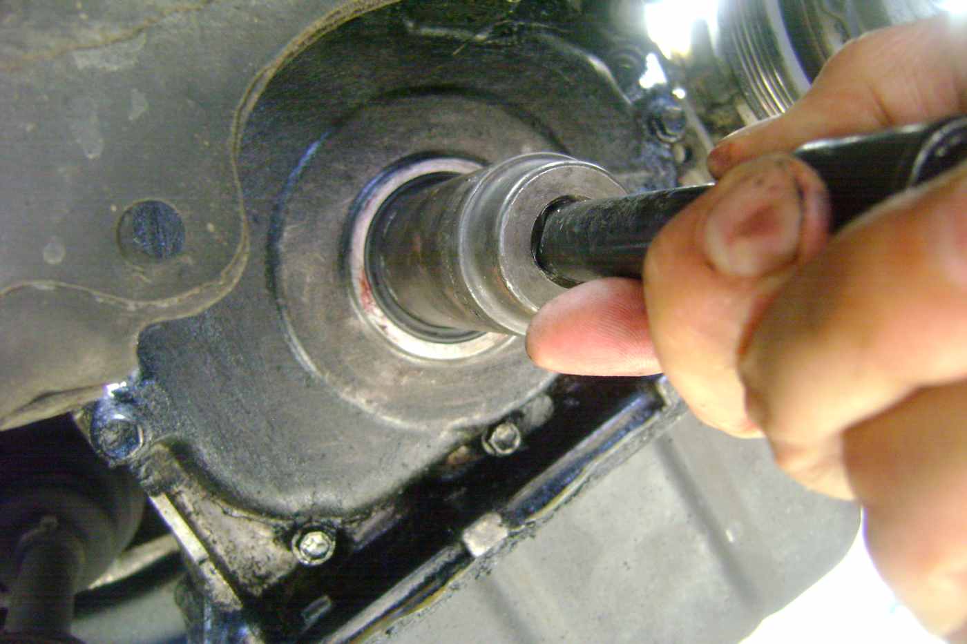 Replacing the Crankshaft Seal, Accessory Belt, and Tensioner Pulley on