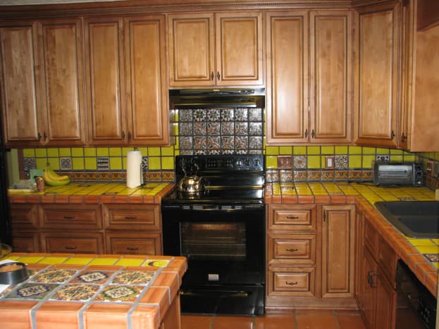 Decide how you want to use decorative tiles: borders, scattered, or in solid blocks.  We used all three in this kitchen.