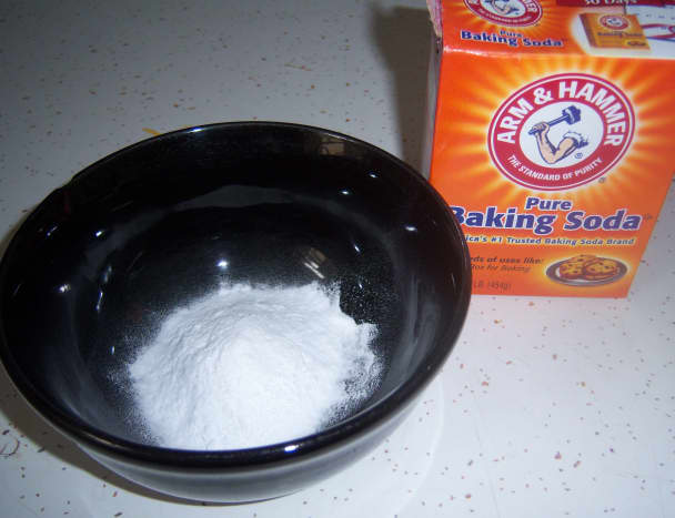 You won't need too much baking soda to make enough past for a four burner gas stove top.