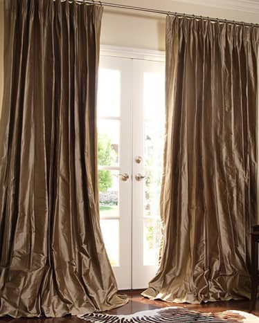 These curtains are most likely lined and interlined to add volume and protection from the sun.