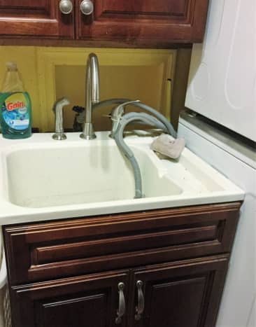 My laundry room, with sink: Solve washer overflow by installing a sink for draining water from washer.