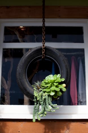 There are so many different ways to turn old tires into new planters!